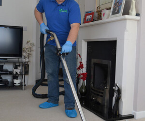 David Roberts in the process of cleaning carpet